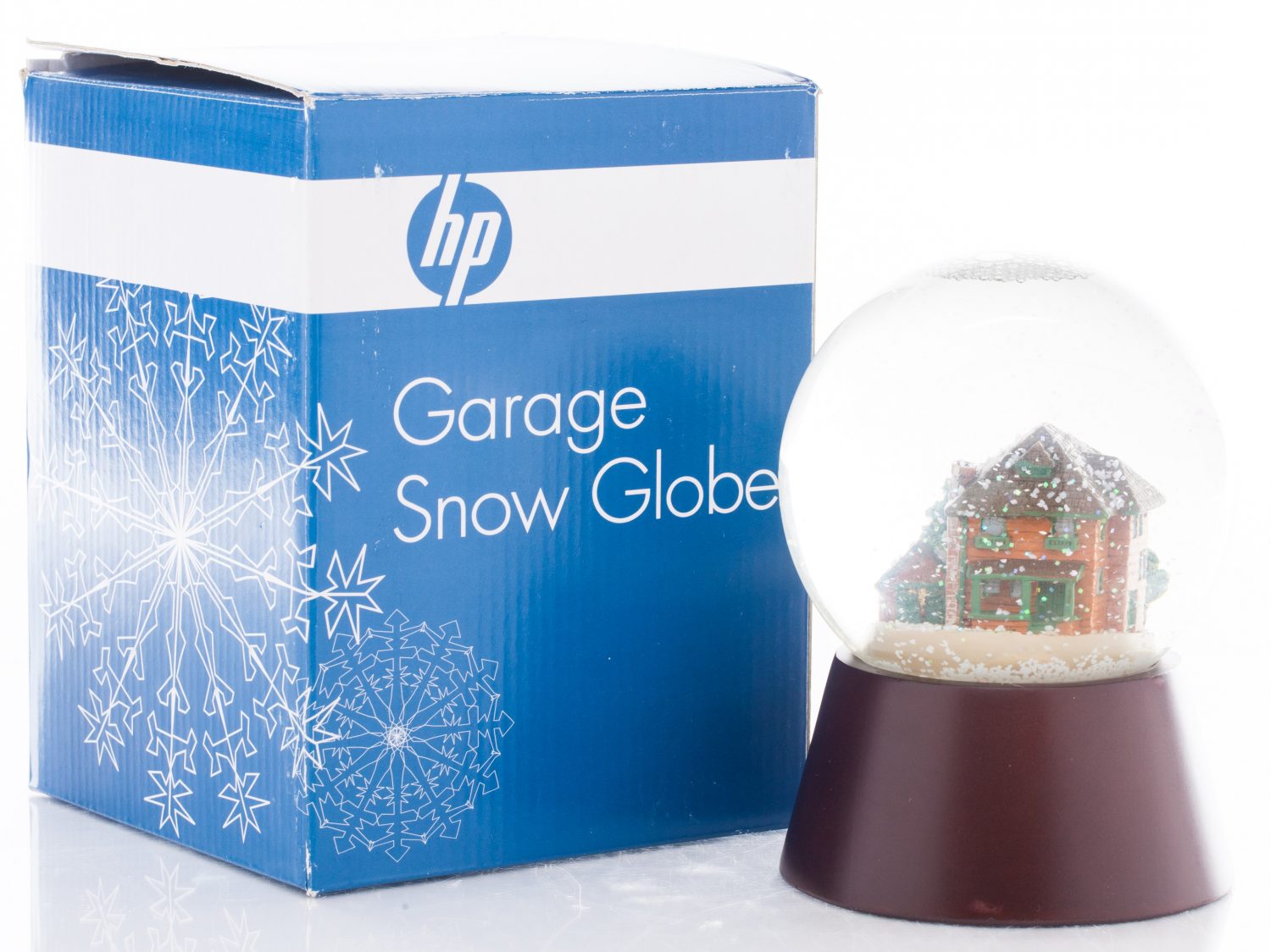 The Garage Snow Globe featuring the Addison Avenue property including the garage, house & shed.
