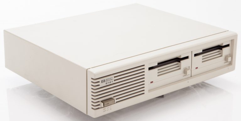 Angled view of the HP 9121 3.5-inch floppy disk drive.