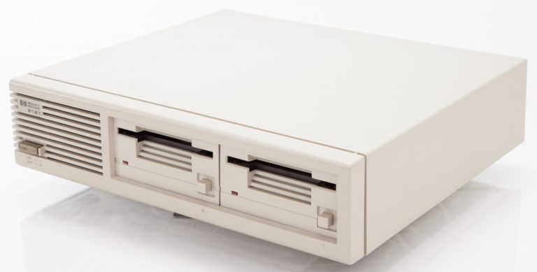 Angled view of the HP 9121 3.5-inch floppy disk drive.
