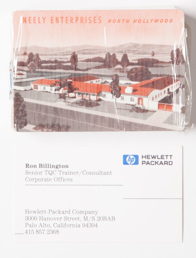 A deck of Neely Enterprises branded playing cards with a business card for sales rep Ron Billington.