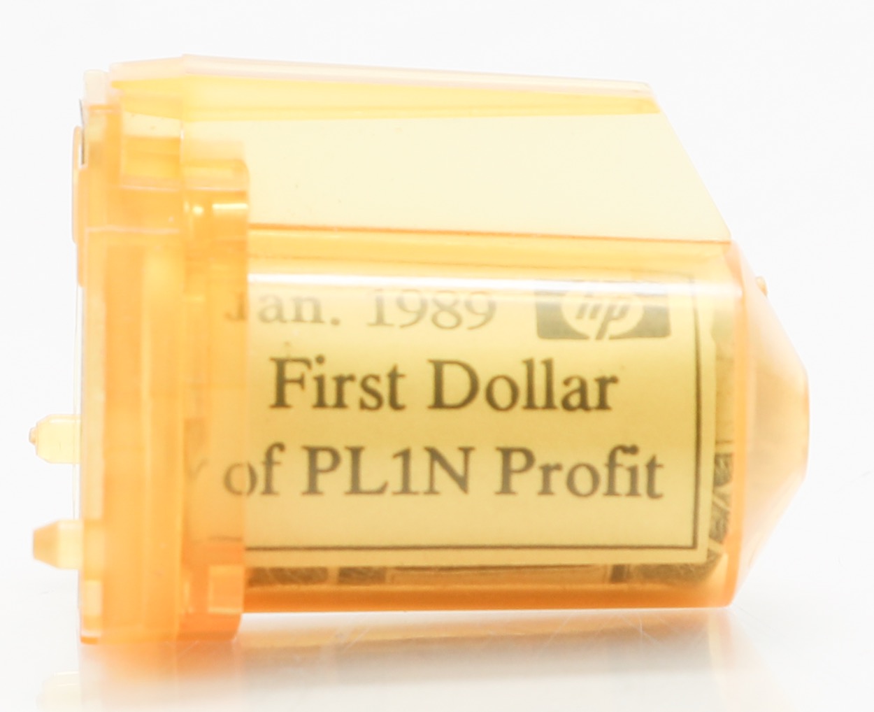 An unused inkjet cartridge holding the first dollar Hewlett-Packard's PL1N line brought in.