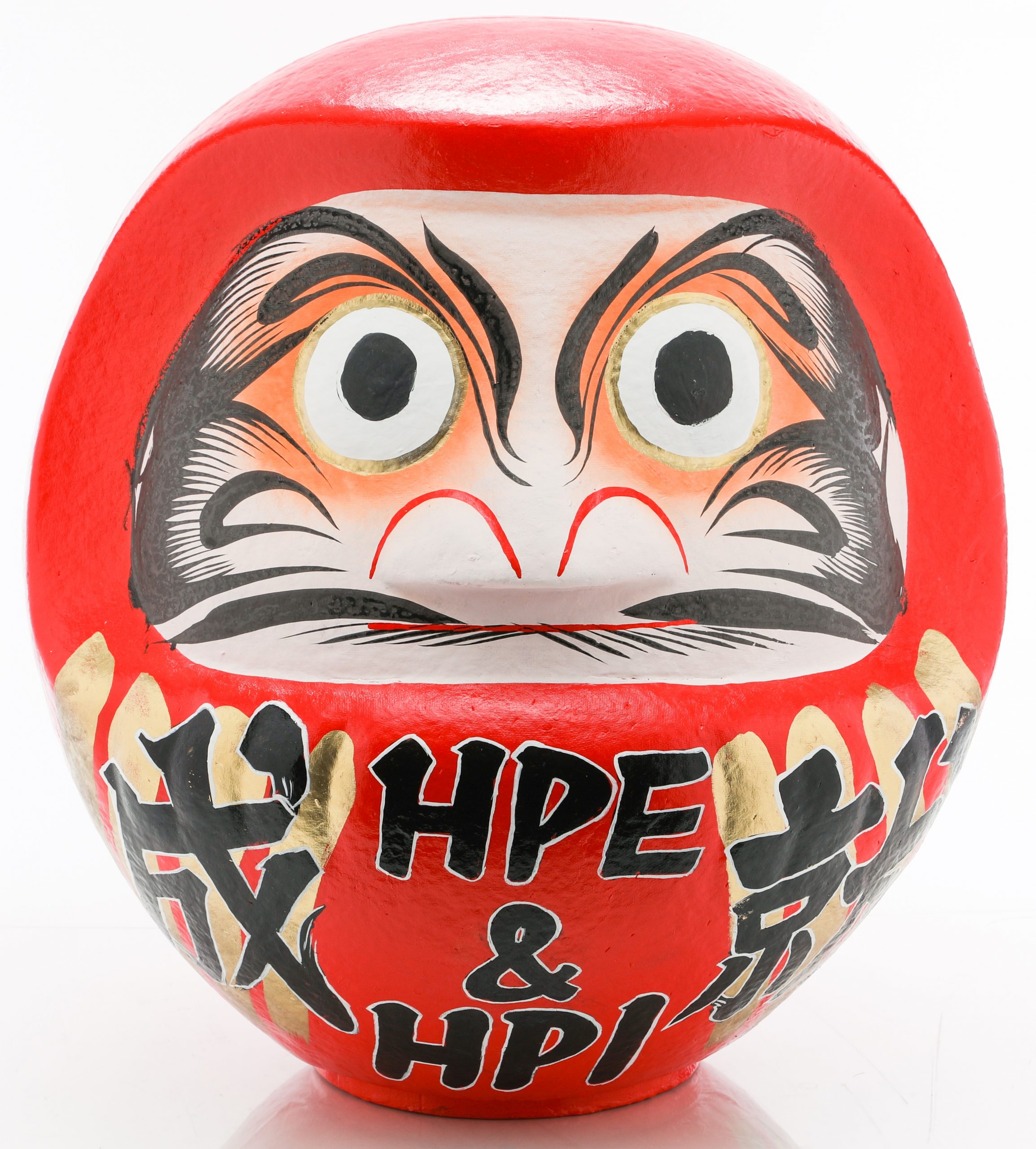 A red Daruma doll with eyes open and HPE & HPI written on the bottom half.