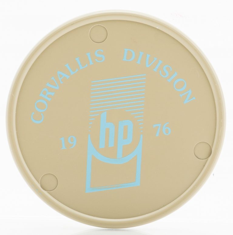 A coaster celebrating the opening of Hewlett-Packard's Corvallis facility in 1976.