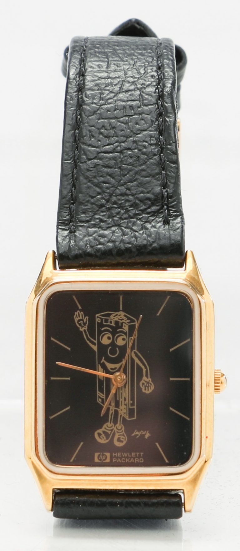 A Hewlett-Packard branded wristwatch featuring an anthropomorphic cartoon caricature of a toner cartridge.