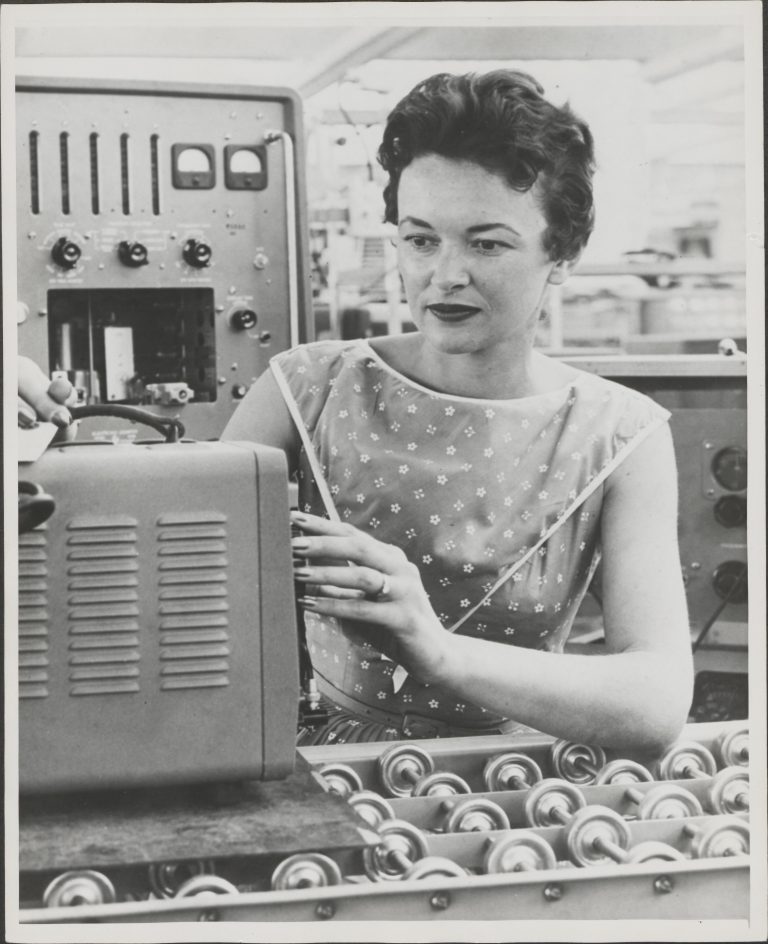 A woman assembling a Hewlett-Packard oscillator in the 1950s or 1960s.