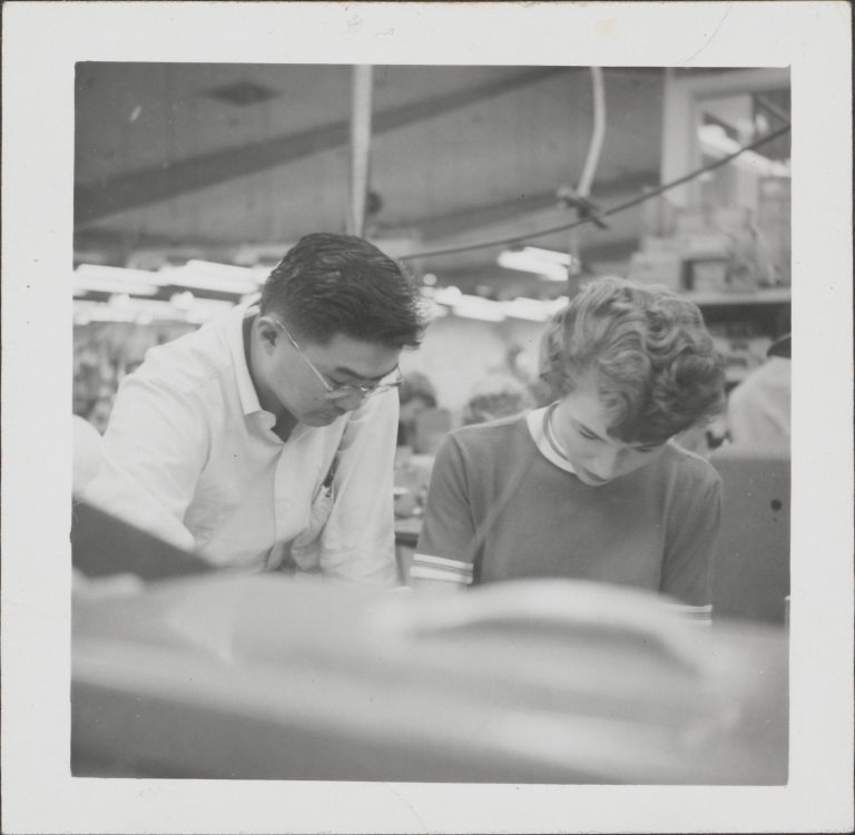 A man and woman working together in 1956.