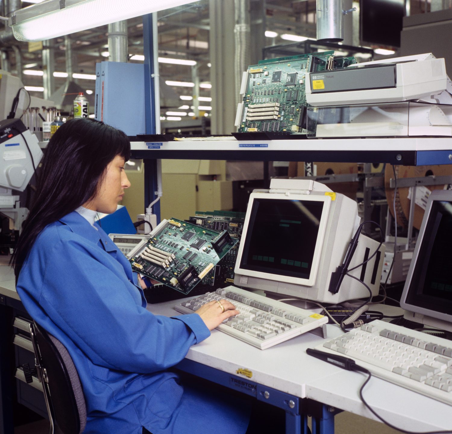 Woman working at a workstation in Hewlett-Packard's Bergamo Hardcopy Operation in 1995.