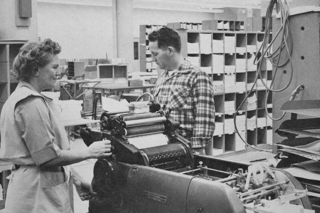 The cover of Watt's Current from January 1961 with Patrica Vogt & Wally Brann working on a Dressagraph Multilift Model 1275.