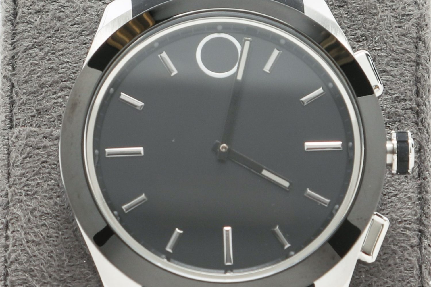 The Movado Bold Series watch with black face and straps and silver-colored accents and frame.