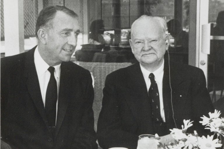 Dave Packard seated next to former US President Herbert Hoover in 1960.