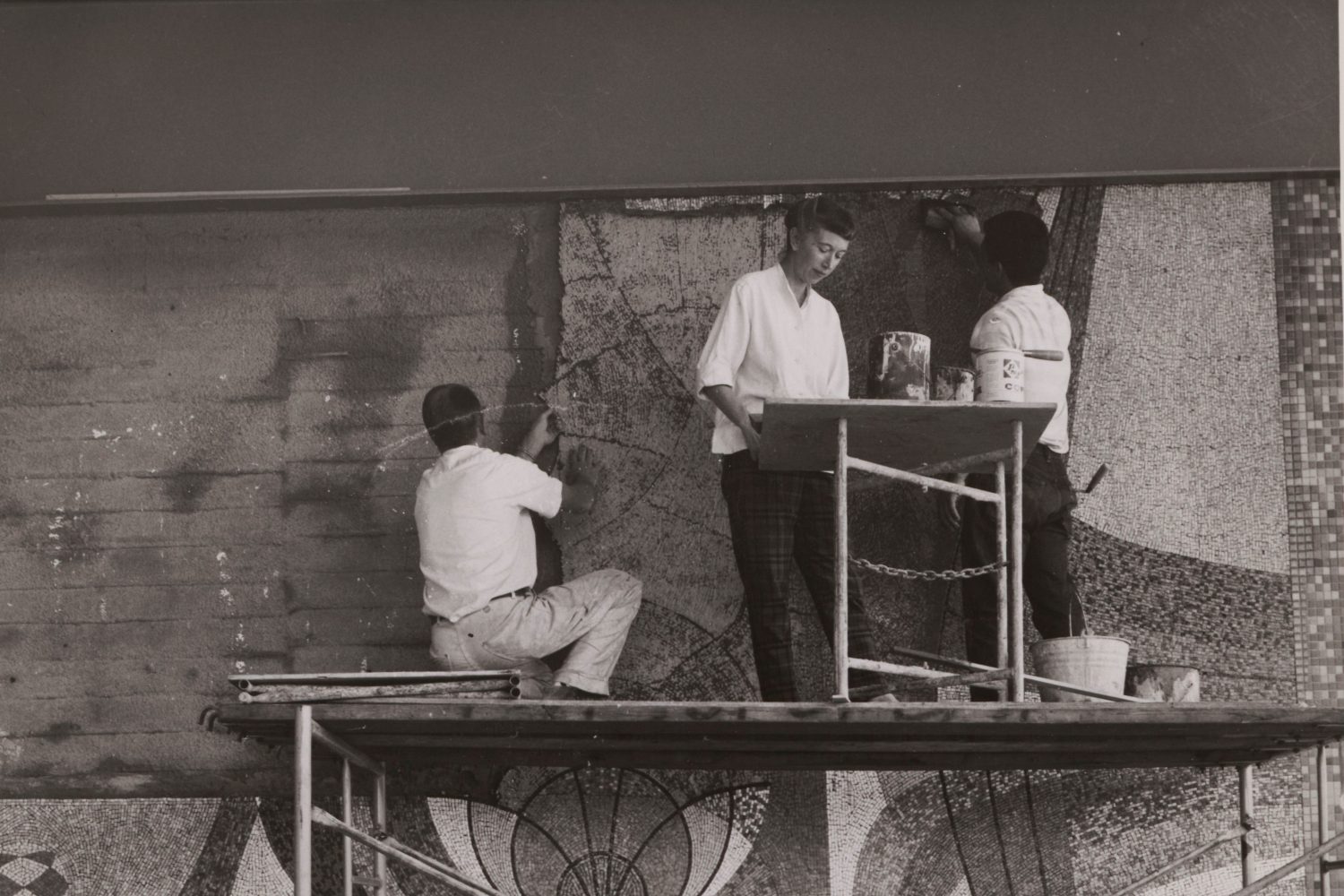 Mary Henry and two others installing a mosaic at the front entrance of 1501 Page Mill Road in 1960.