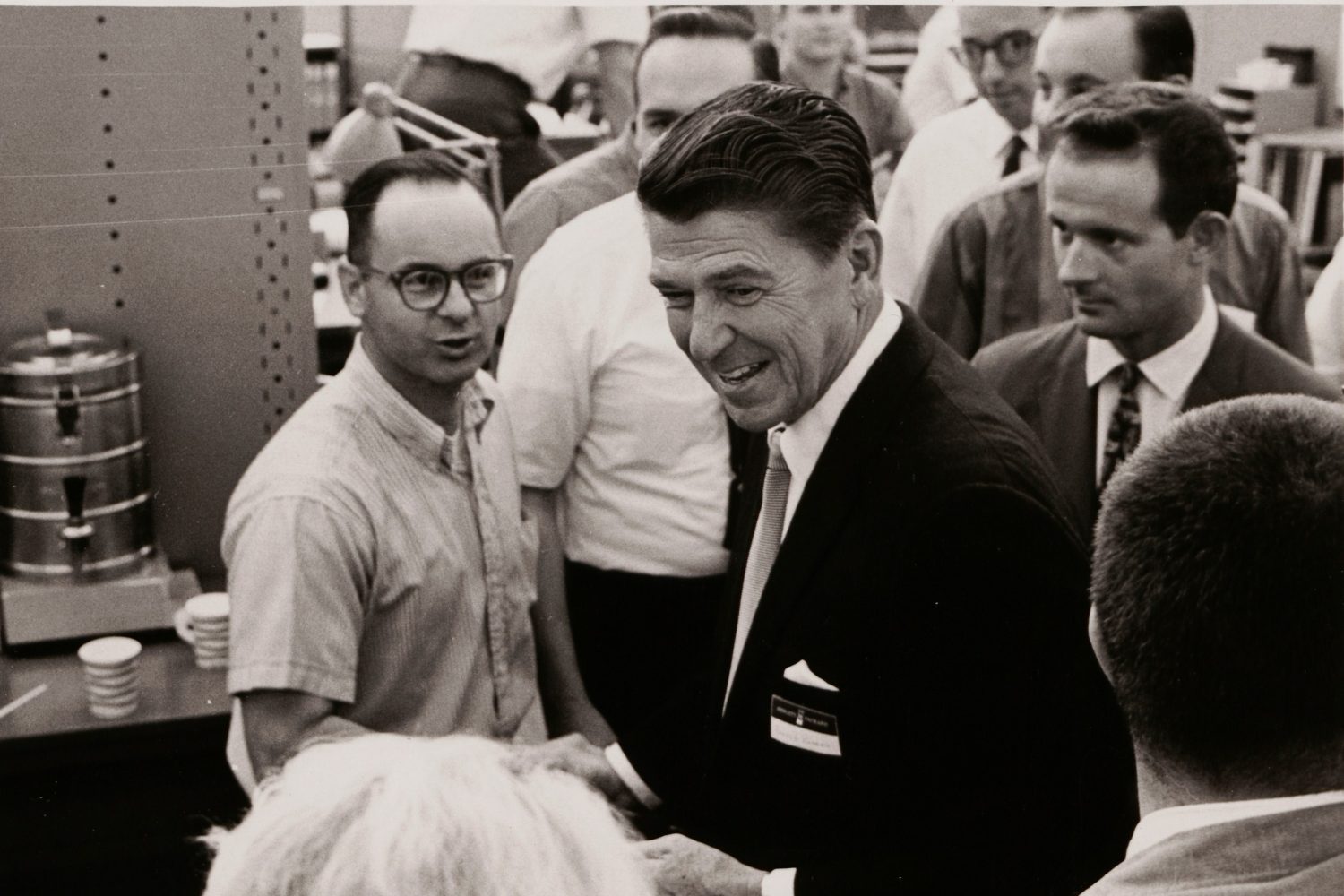 A photo of Ronald Reagan speaking with employees during his visit to Hewlett-Packard in 1966