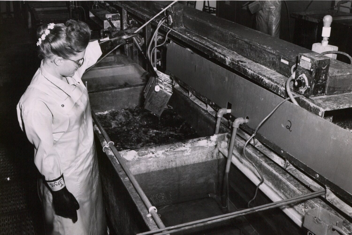 A woman etching circuits at the Palo Alto facility in the 1950s or 1960s.