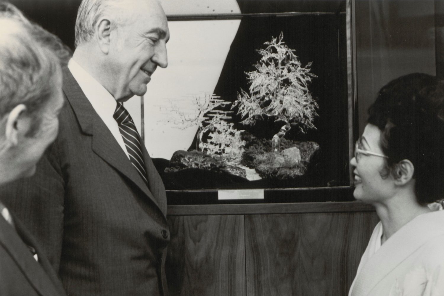 Kyoko Sagimori of Hewlett-Packard's Santa Clara division speaks with Dave and Bill in front of the glass bonsai tree.