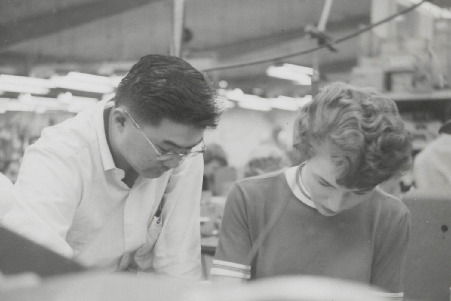 A man and woman working together in 1956.