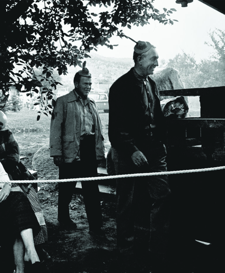 Bill Hewlett and Dave Packard wearing tiny hats during a skit at the dedication of HP Loveland in 1962.