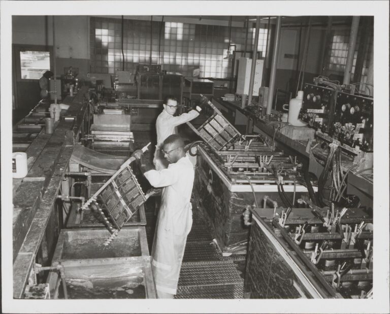 Two HP employees dip-soldering circuits in the Palo Alto production facility in the 1950s.