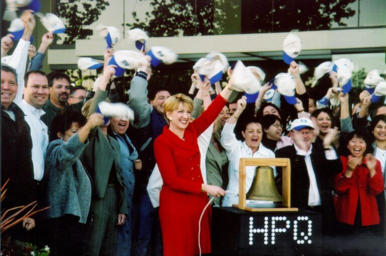 Carly Fiorina rings the bell to open the NYSE after acquiring Compaq.