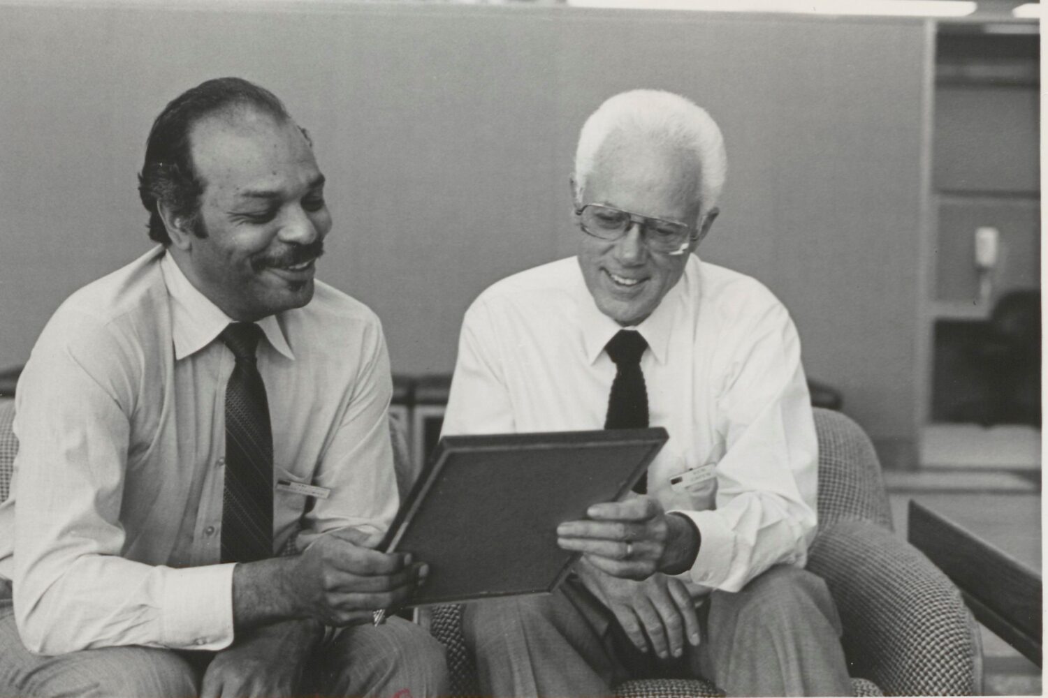 Harry Portwood (left) and Ken Capen (right) admiring the Corporate Commitment Award.